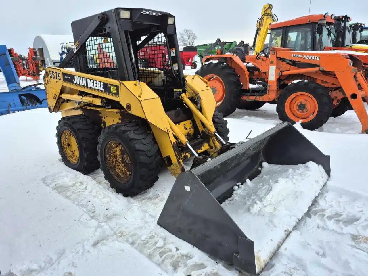 1996 John Deere 557 chargeuse à direction à glissement