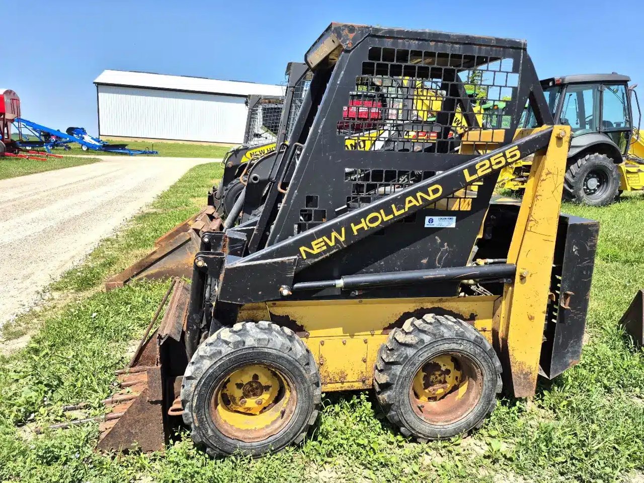 1995 New Holland L255 chargeuse à direction à glissement