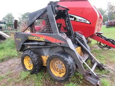 New Holland LS170 chargeuse à direction à glissement — photo 2